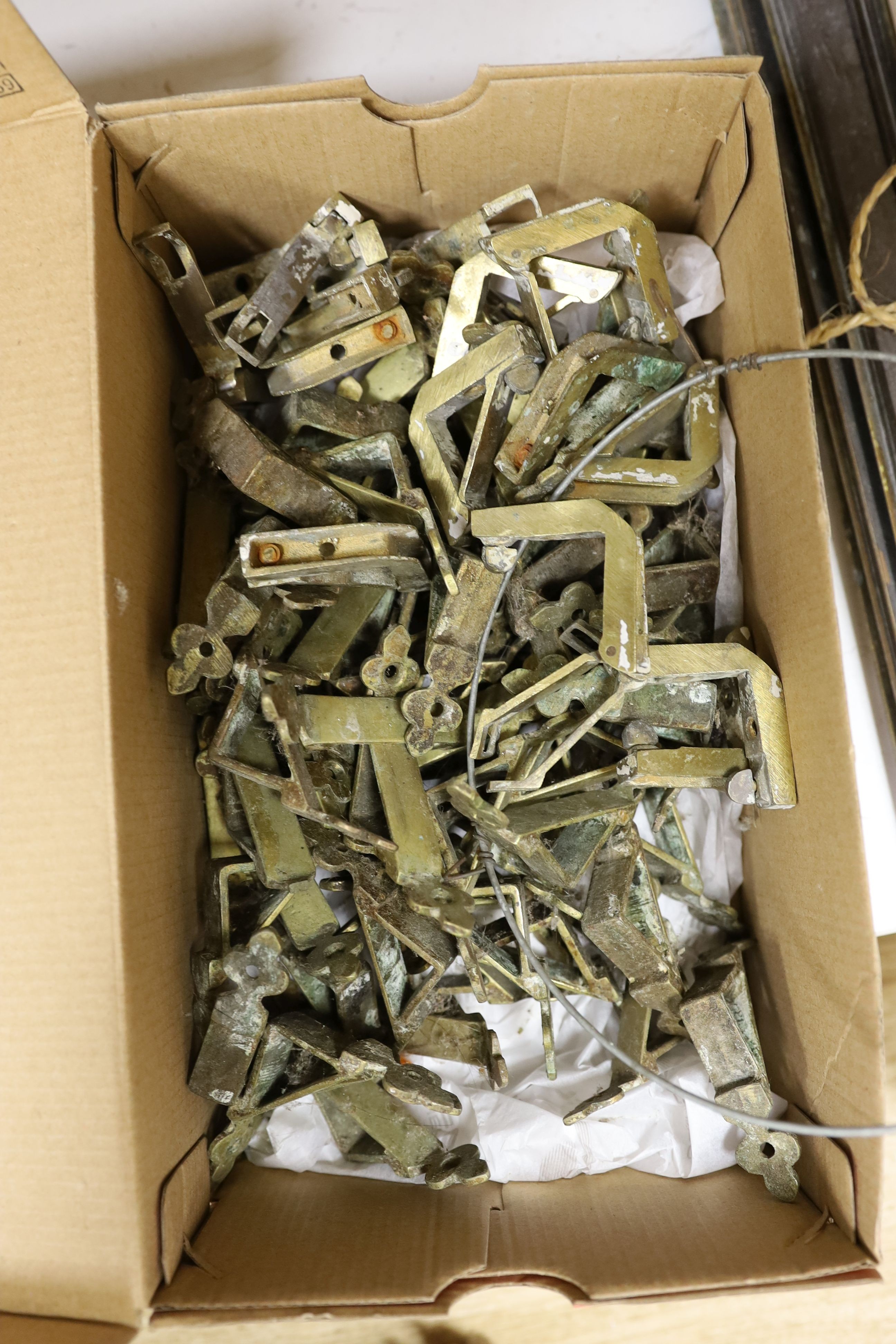 Two sets of brass stair rods with fittings.
